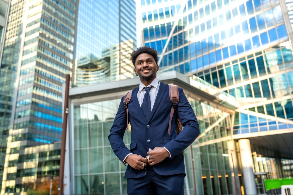 Young,African,American,Businessman,Smiling,,Looking,Ahead,While,Standing,Confidently